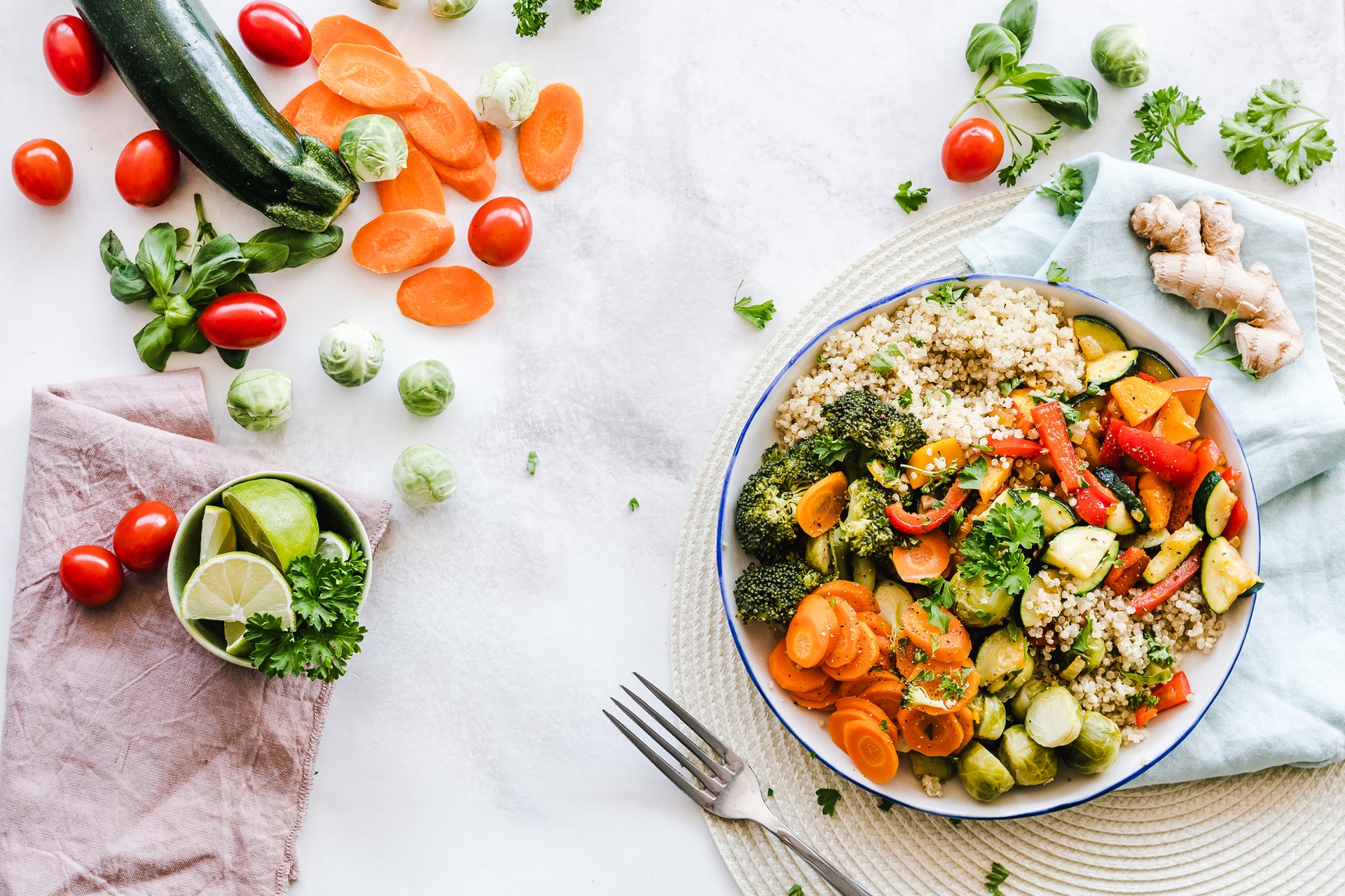 table covered in vegetables and a meal that may help boost fertility