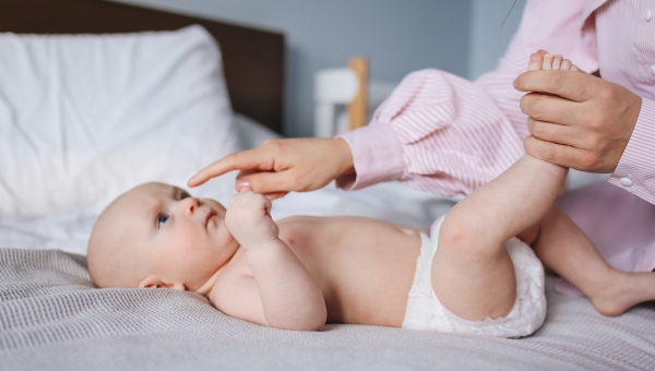 mother playing with her baby