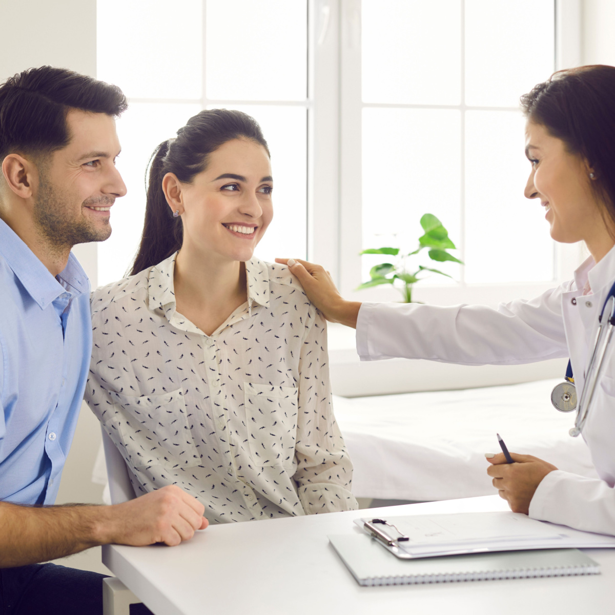 A couple talking to an IVF doctor
