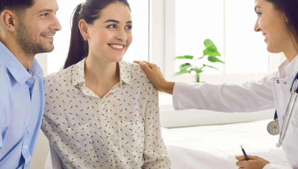 A couple talking to an IVF doctor