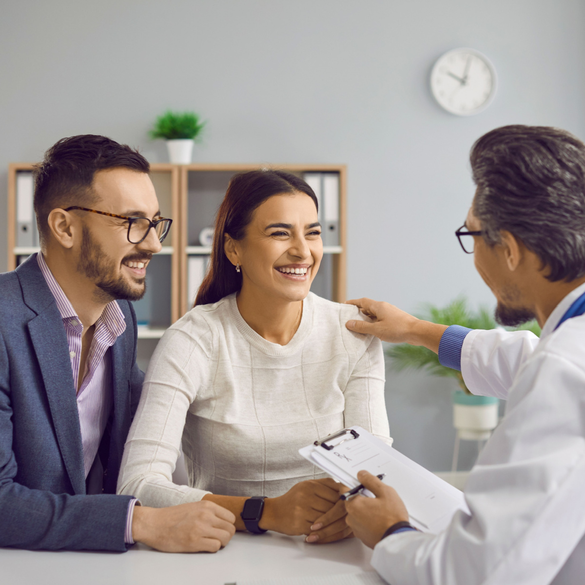 A couple talking to an IVF doctor