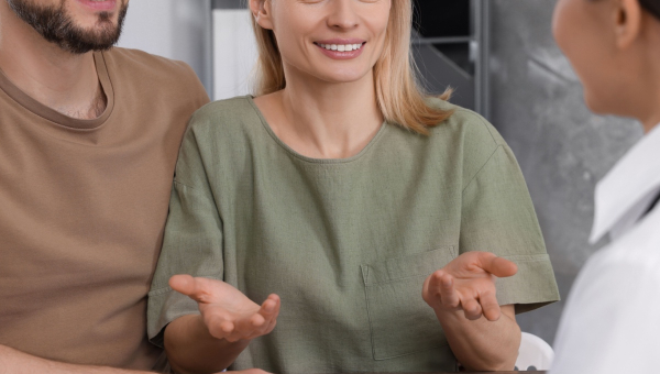 A couple talking to a the Woodlands IVF specialist